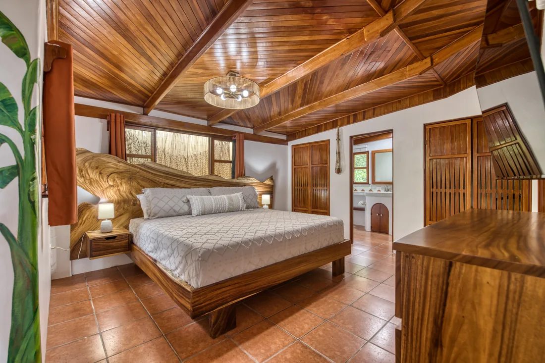 Wood-beamed bedroom at Casa Primera